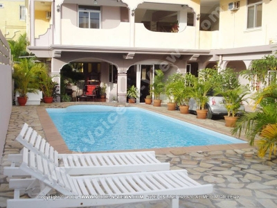 general view of the pool and its sunbeds summer hotel
