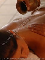 relaxing_massages_mauritius_preskil_beach_resort_guest_in_massage_room.jpg