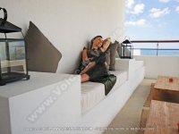 le_recif_hotel_mauritius_lady_relaxing_on_the_balcony_with_sea_view.jpg