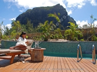les_pavillons_hotel_mauritius_lady_relaxing_in_sunbed_near_the_pool.jpg