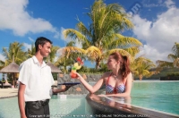 laguna_beach_hotel_and_spa_mauritius_guest_having_cocktail_in_the_swimming_pool.jpg