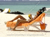 lady_having_her_sun_bath_on_the_beach_la_palmeraie_mauritius.jpg
