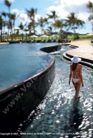 anahita_resort_mauritius_lady_in_edge_of_swimming_pool_watermark_view.jpg