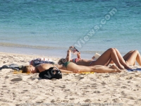 woman_lying_sunbath_beach_le_morne_mauritius.jpg