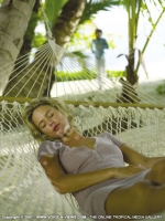 sainte_anne_resort_seychelles_lady_relaxing_in_hammock.jpg